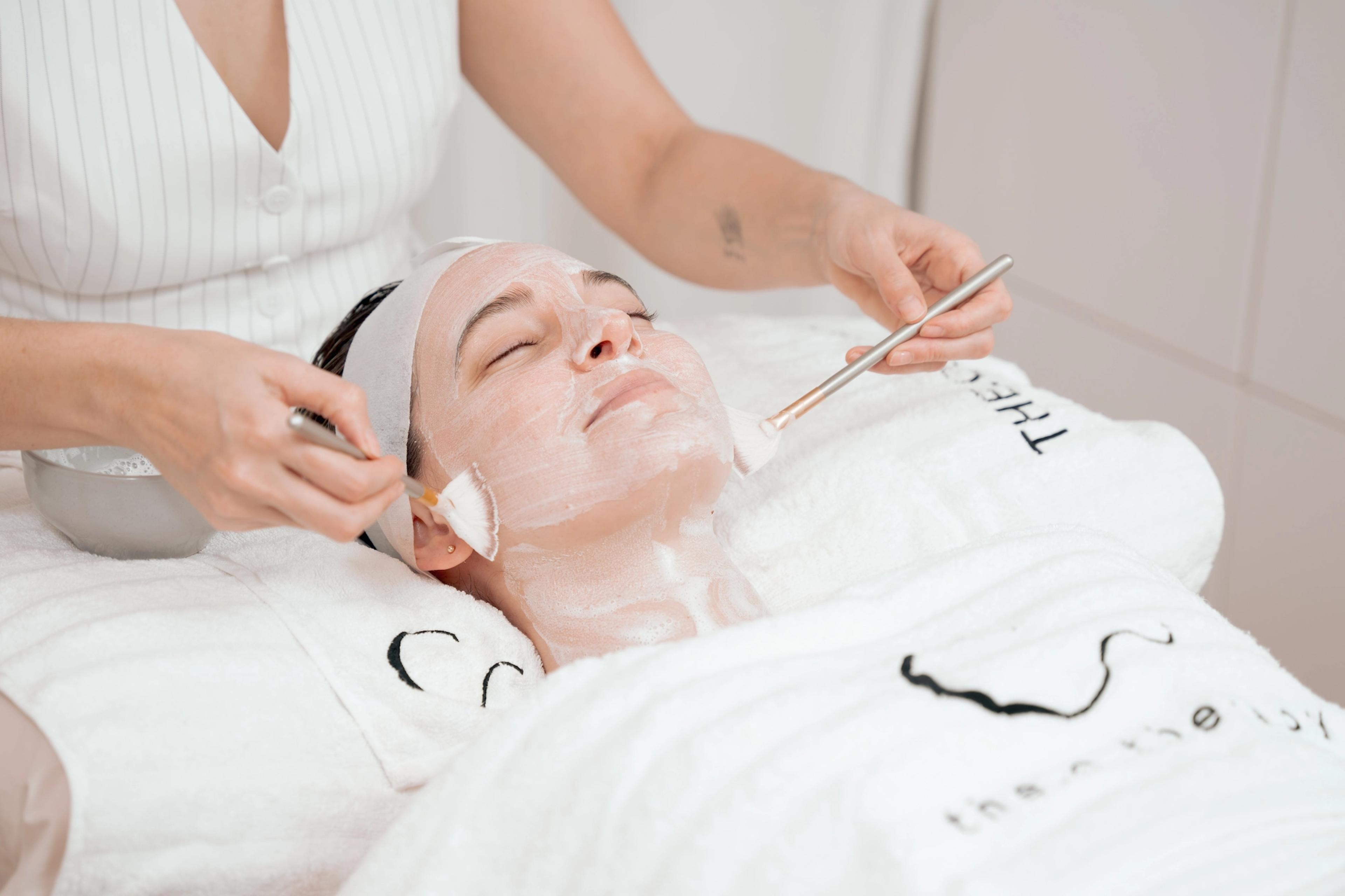 Woman reciving facial treatment